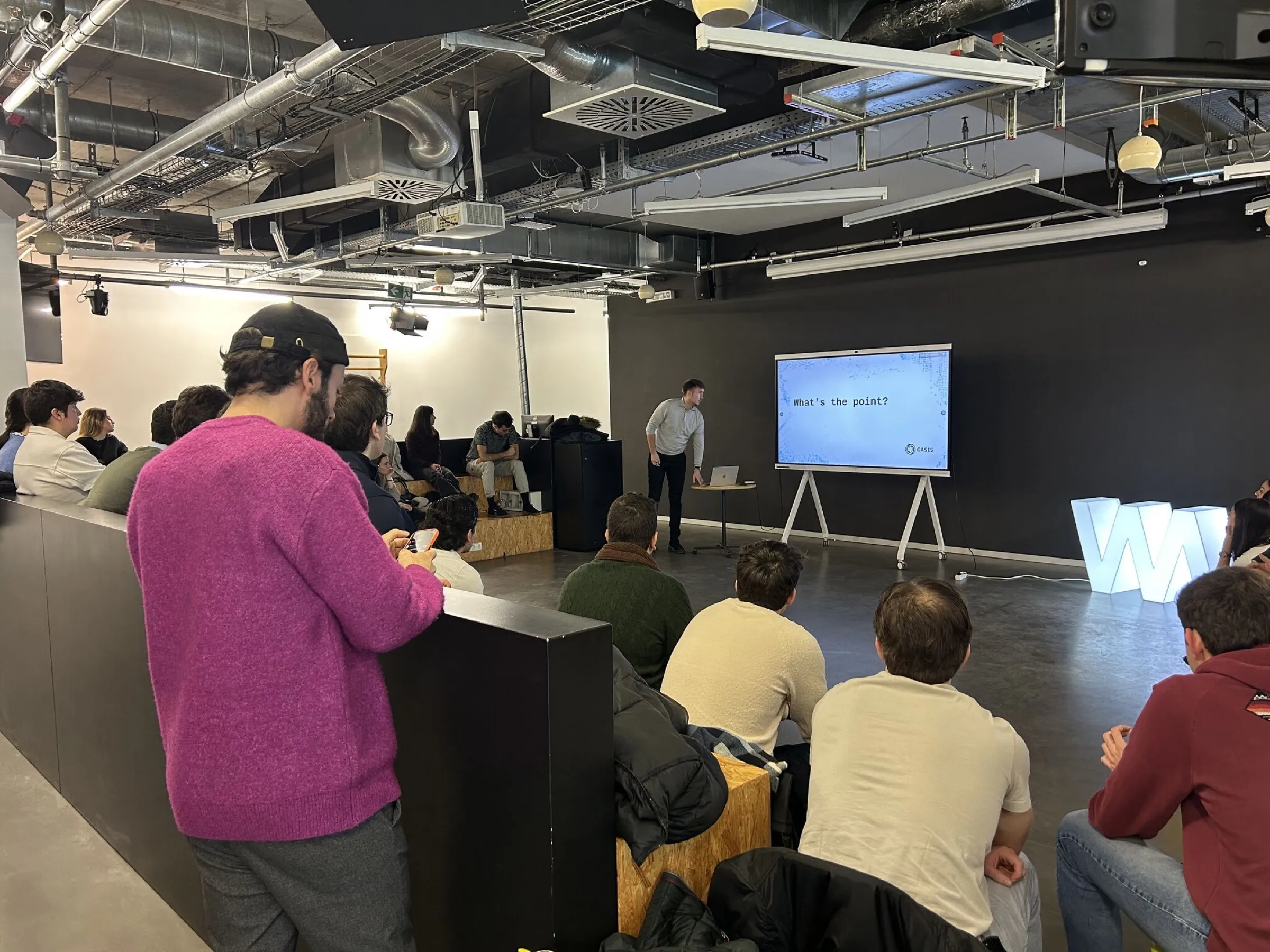 Marko presenting to a room of students